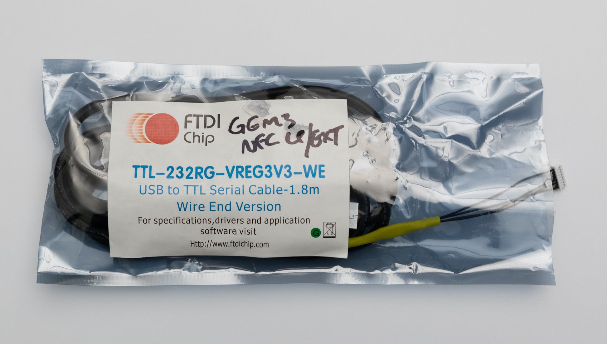 Image of a GEM3NFC LP/EXT FTDI cable in packaging from the front