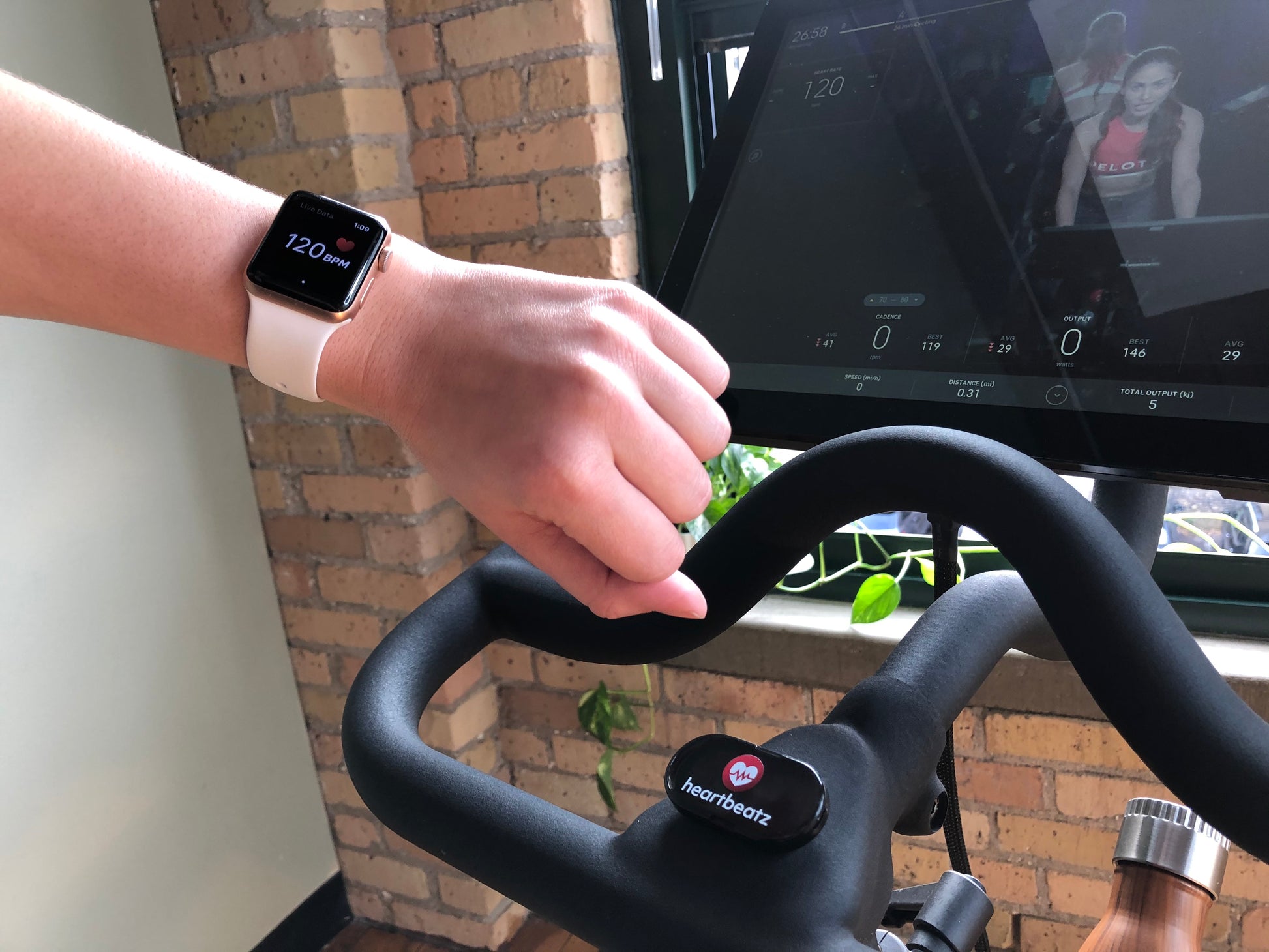 Image of an indoor cyclist using a heartbeatz POD and the NPE heartbeatz app for virtual training